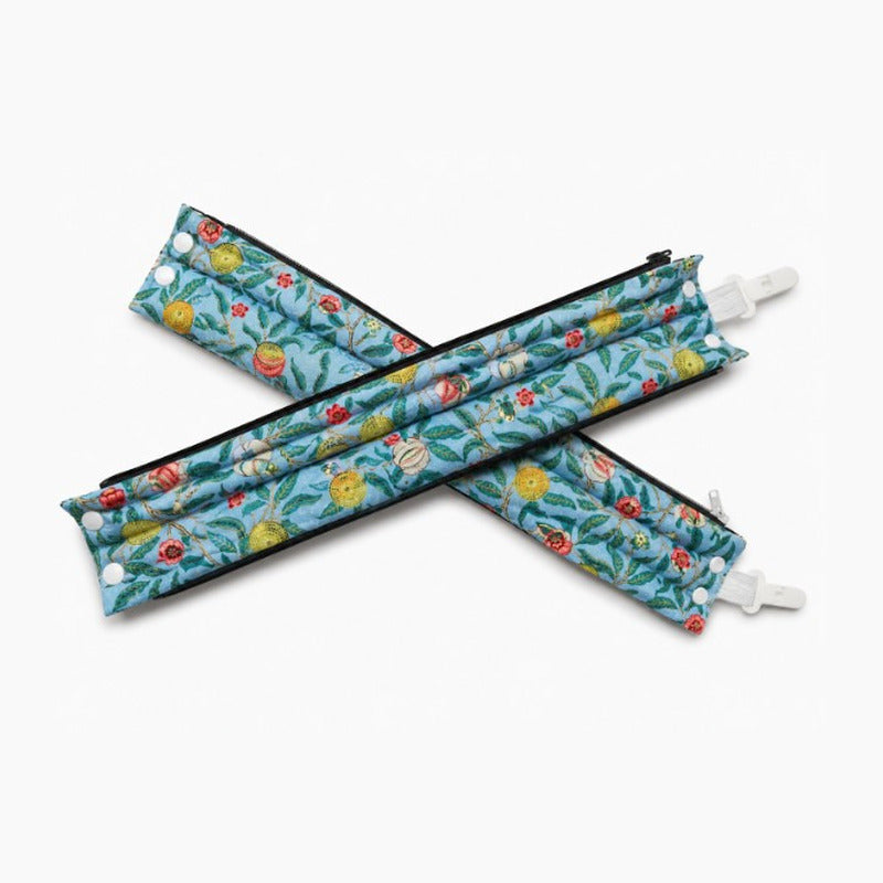 The Cocoon Sleeve in Four Fruits — two sleeves laid in a cross
